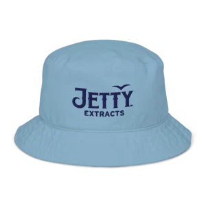 Jetty Extracts baby blue bucket hat with navy 3D puff embroidered logo flat lay view