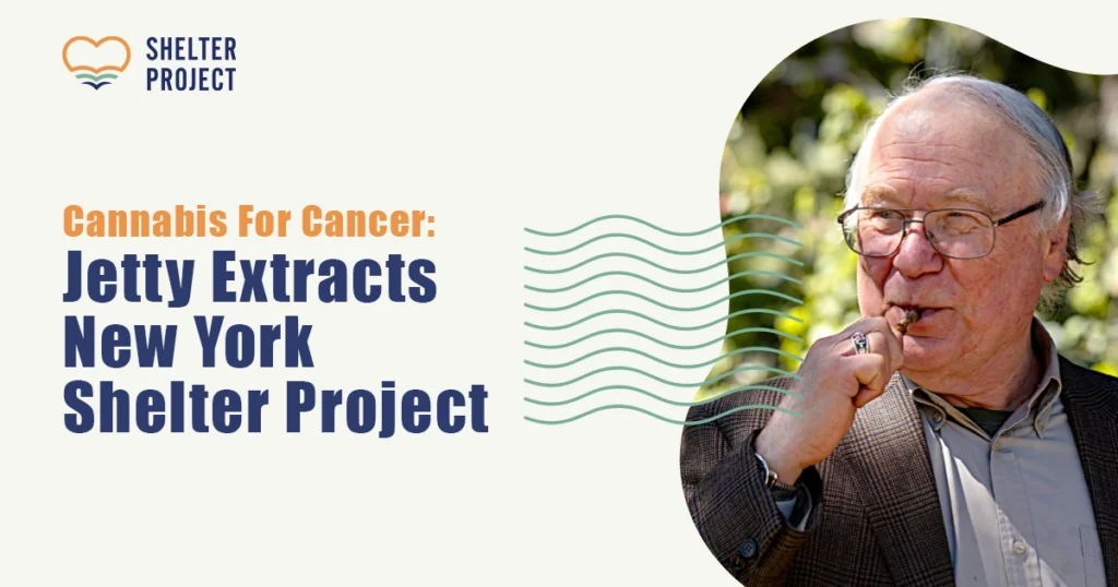 A promotional image for the Jetty Extracts Shelter Project titled “Cannabis for Cancer: Jetty Extracts New York Shelter Project,” featuring an older man outdoors holding a cannabis vape pen. The design includes the Shelter Project heart logo and wave graphic, symbolizing compassionate access to cannabis for patients.