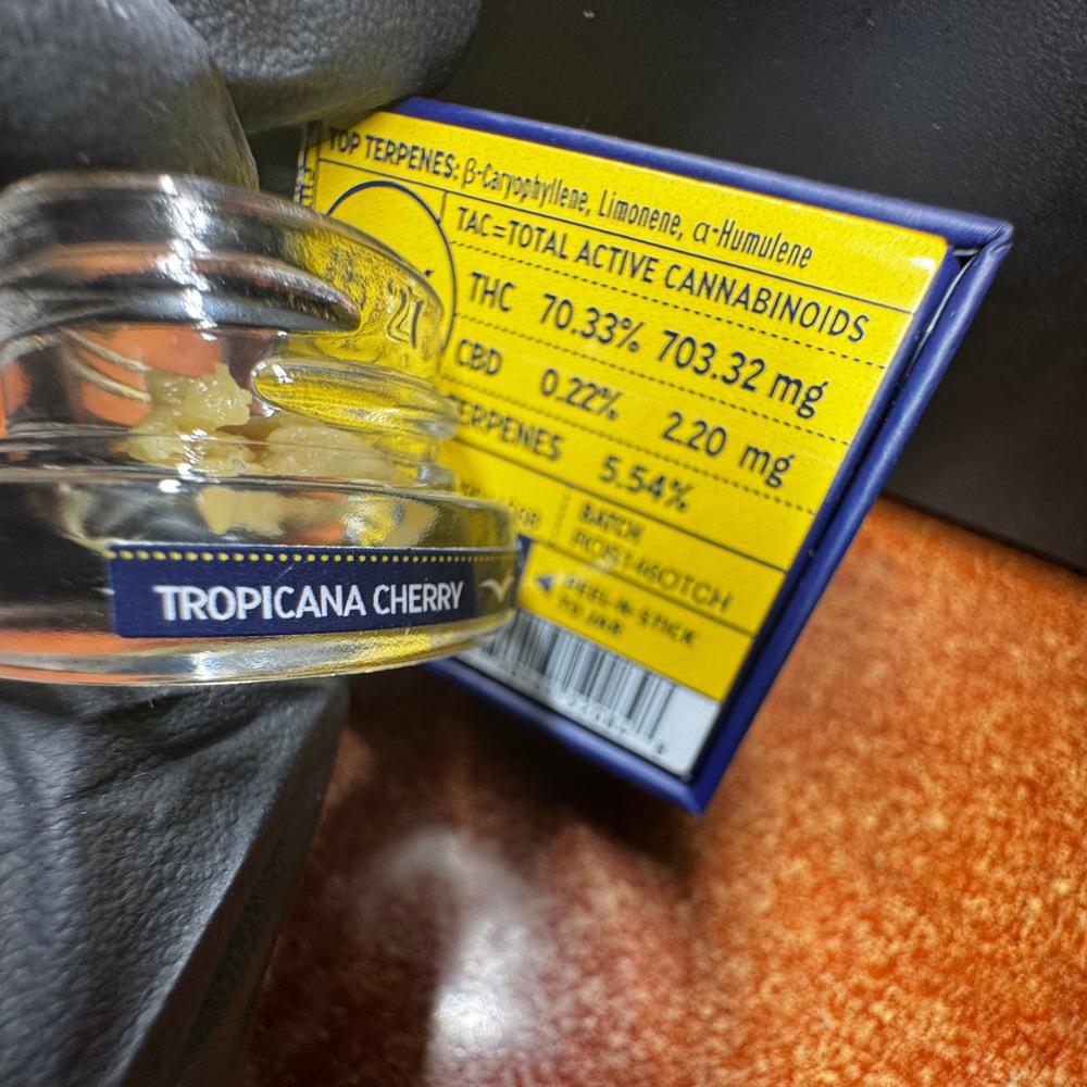 A jar of Jetty live rosin is shown with the new peel-n-stick strain name sticker attached.