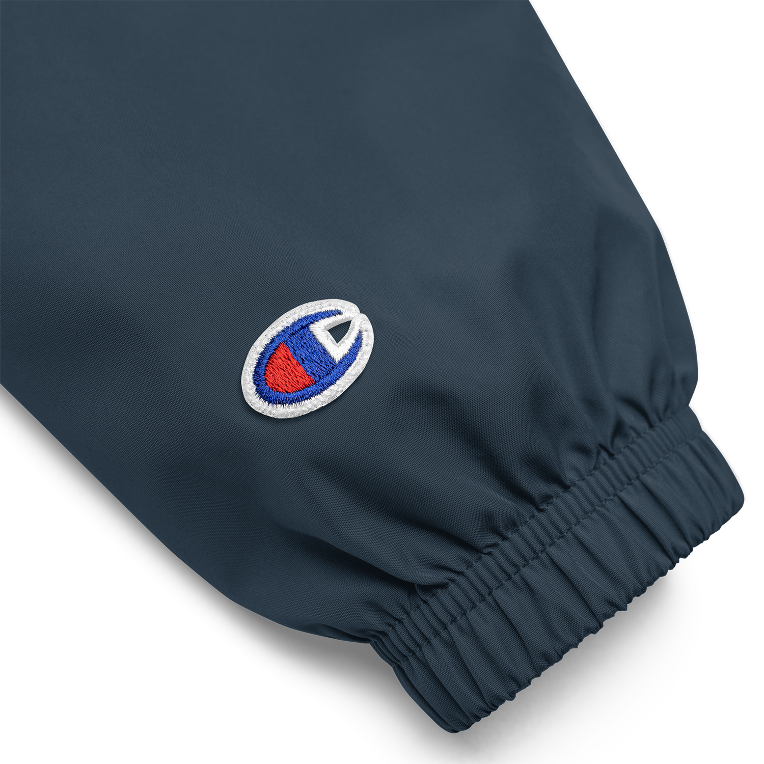 White embroidered Jetty Extracts logo on navy Champion stoner jacket