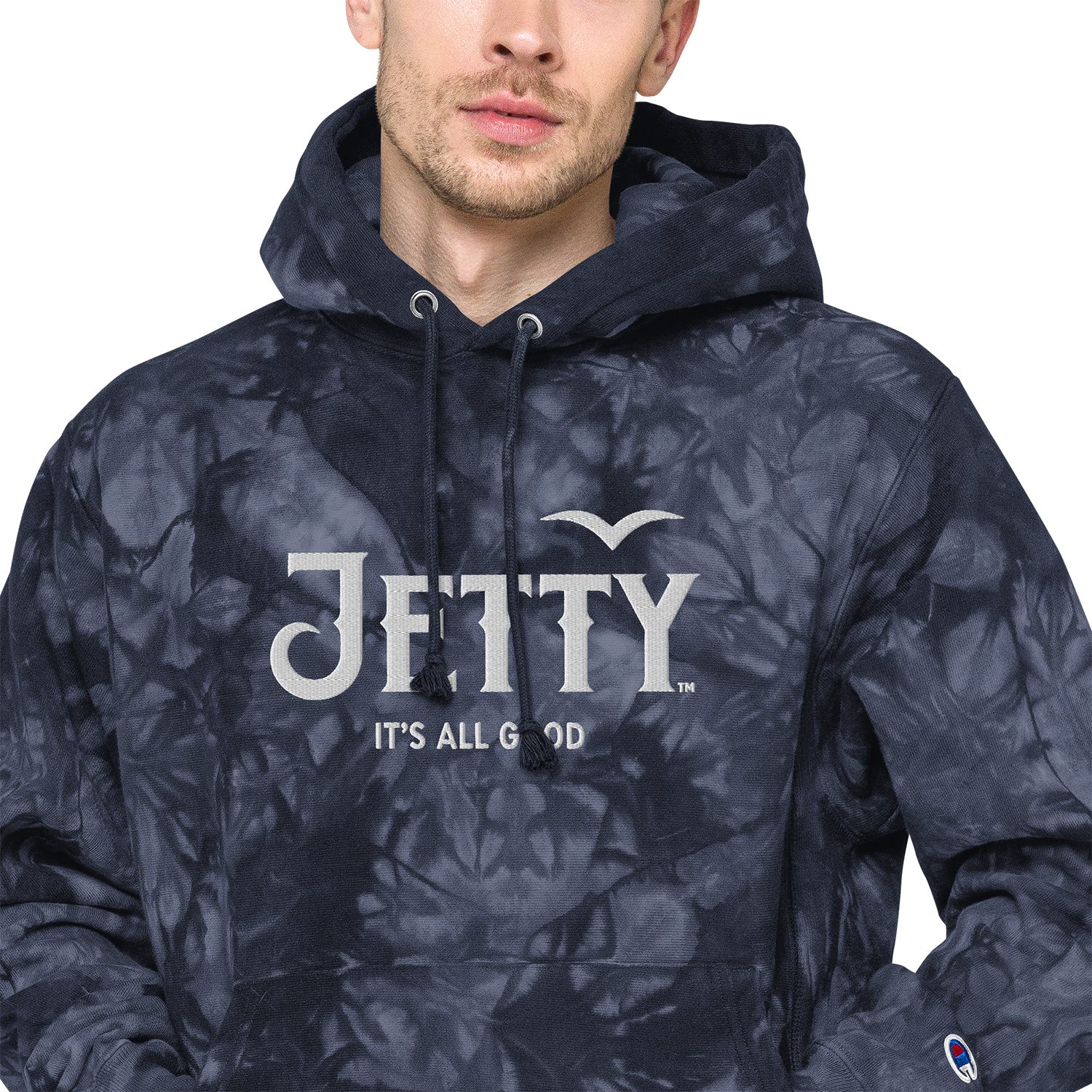 Jetty Extracts tie-dye Champion hoodie in navy with embroidered Jetty cannabis logo and “It’s All Good” tagline.