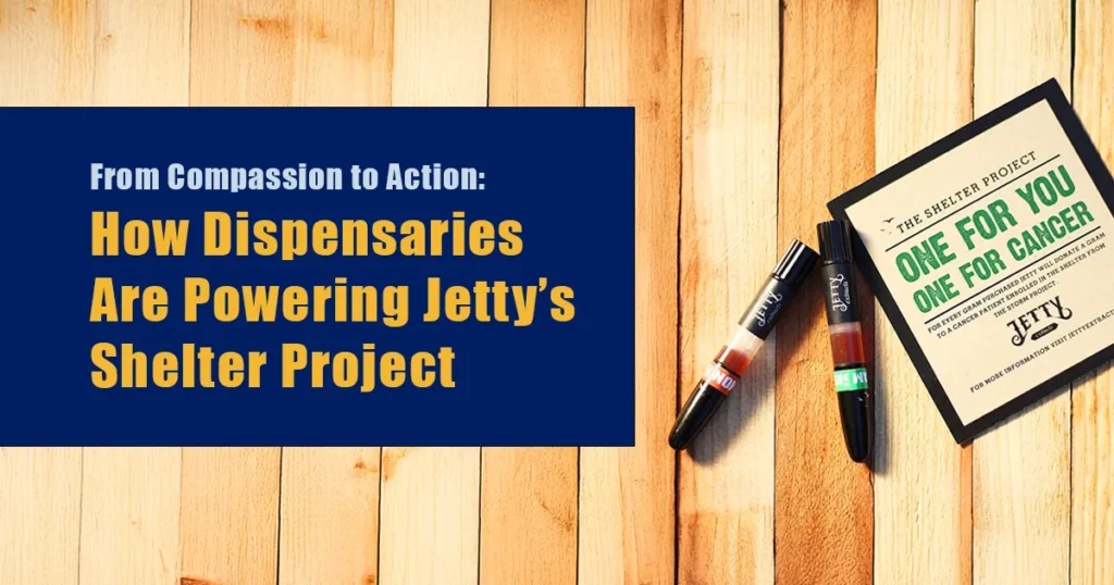 Featured blog image with wooden background showing Jetty vape cartridges and a Shelter Project card reading “One for You, One for Cancer,” alongside the headline “From Compassion to Action: How Dispensaries Are Powering Jetty’s Shelter Project.”