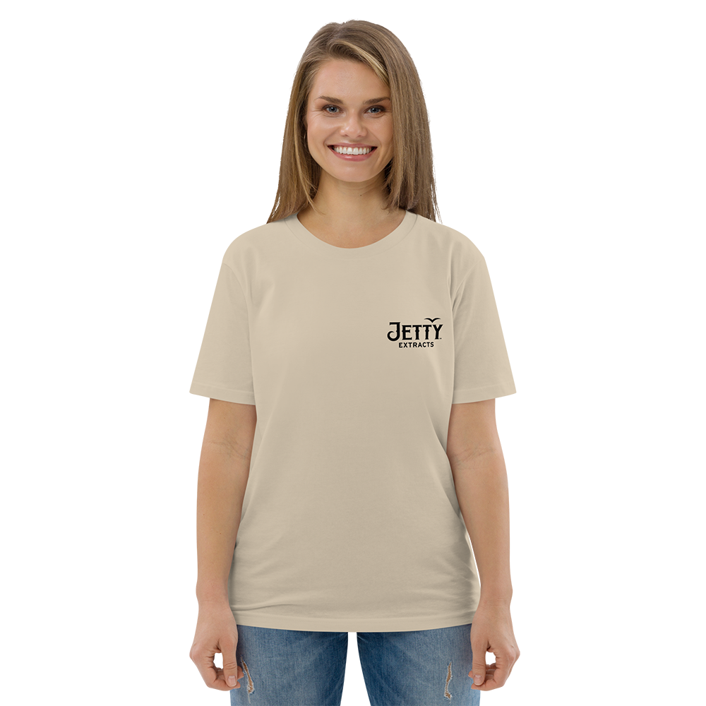 Female model wearing khaki Acapulco Gold organic t-shirt showing black Jetty Extracts logo