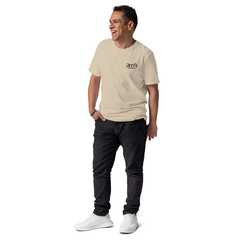 Male model wearing khaki Acapulco Gold organic t-shirt with Jetty Extracts weed vape logo